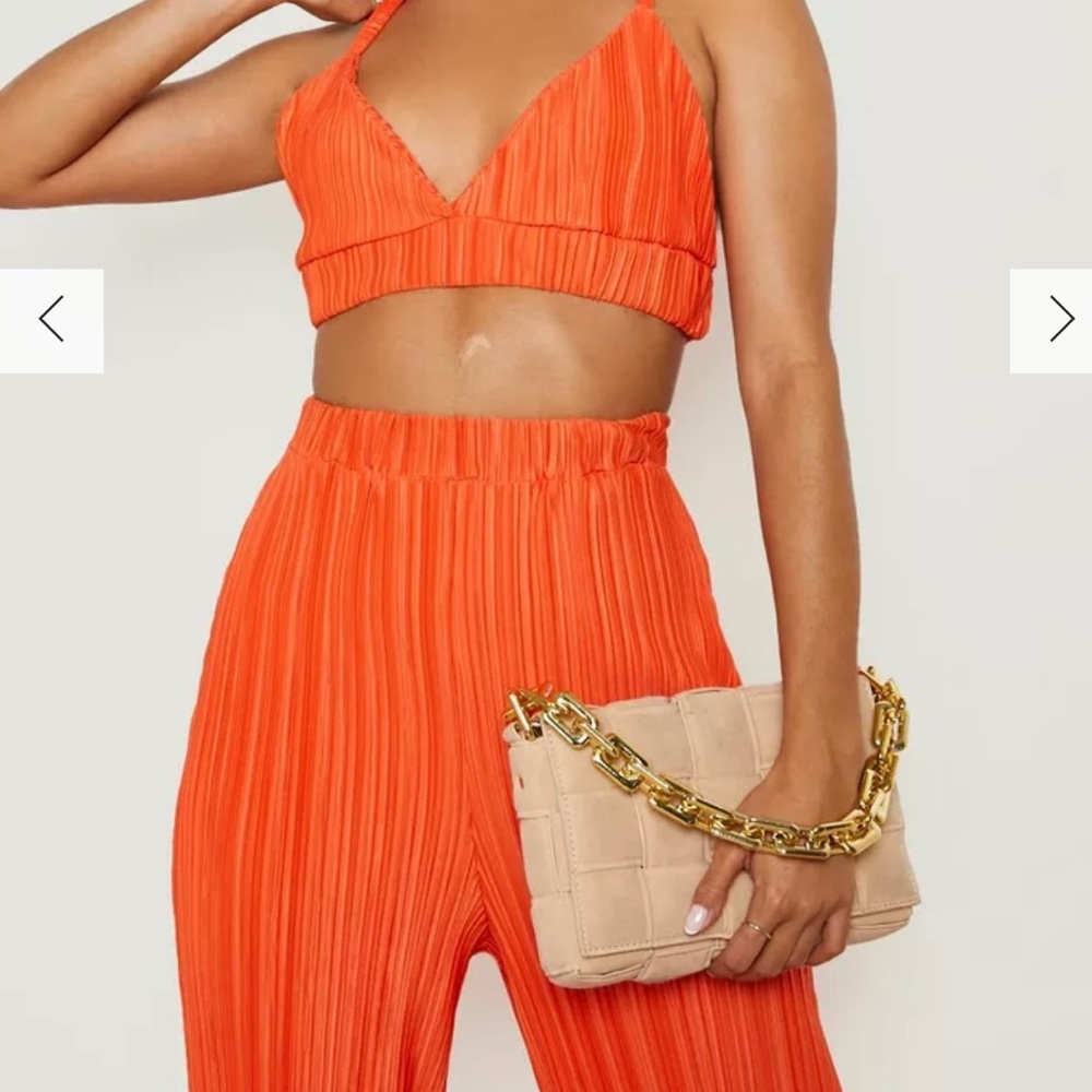 Orange two piece set. Tags attached. Never worn
